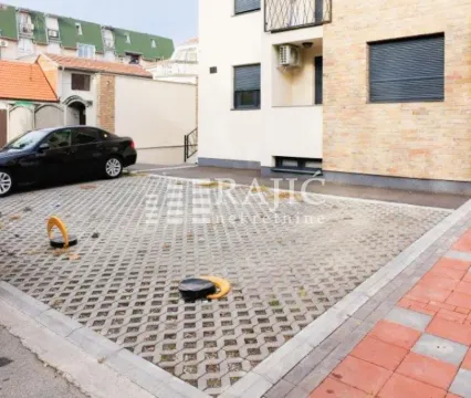 Exterior space with a parking spot in front of the building. - image 12