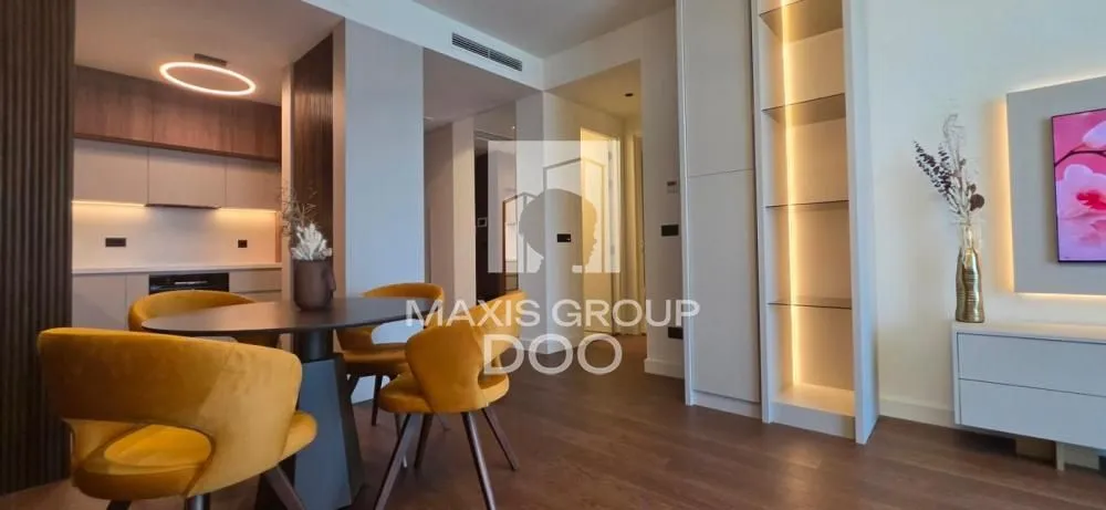 Living room with dining area and open kitchen.
