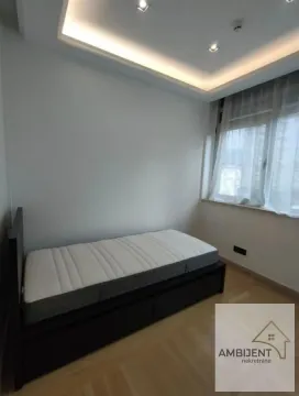 Small bedroom with a bed and a dropped ceiling with lighting. - image 14