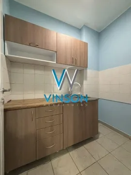 Smaller kitchen with wooden units and a sink. - image 4