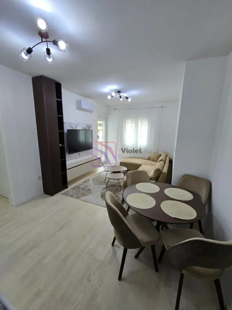 Living room with dining area and furniture.