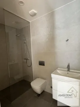 Modernly equipped bathroom with a walk-in shower and washbasin. - image 5