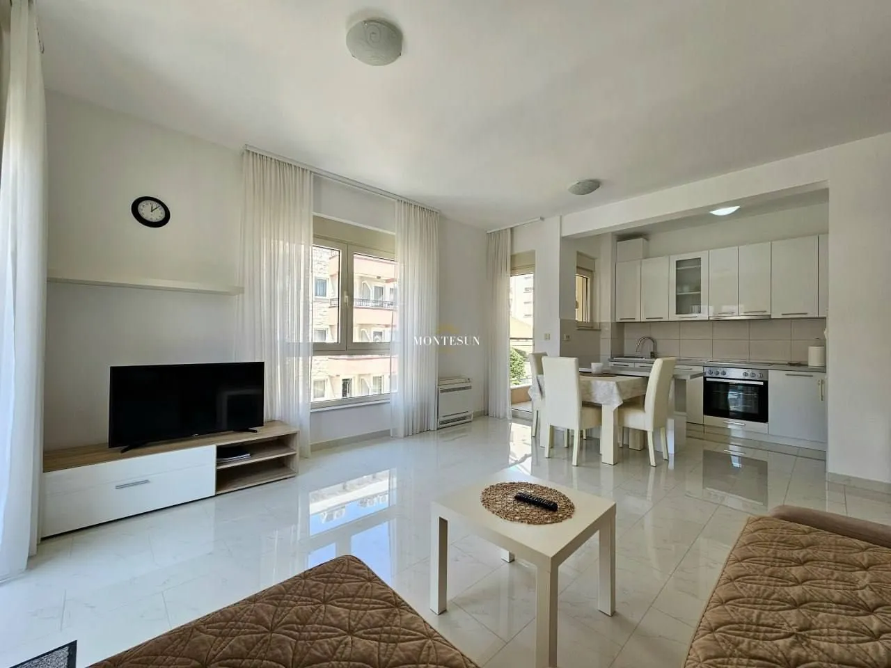 Spacious living room connected to the dining area and kitchen.
