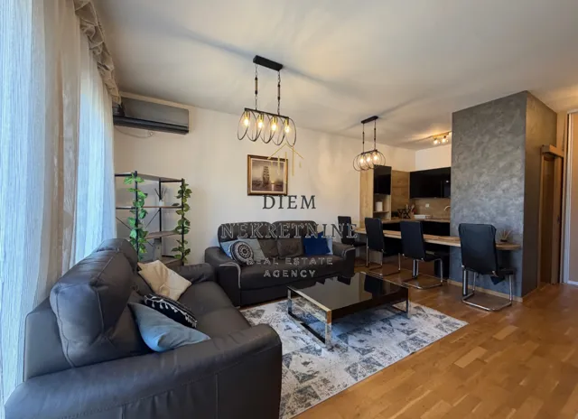 Spacious living room connected to the dining area and kitchen.