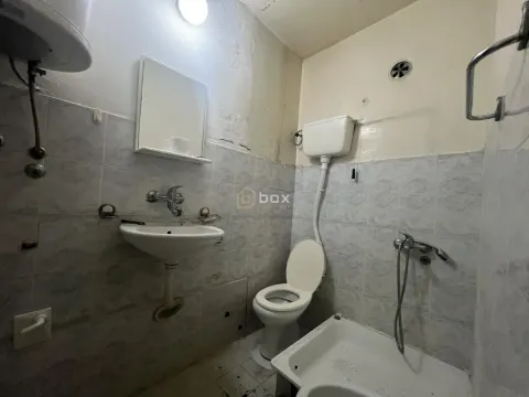 Older equipped bathroom with sanitary fixtures and a shower cabin. - image 6