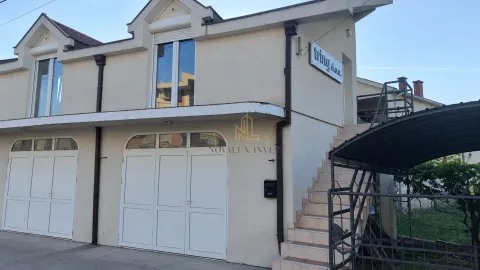 View of the exterior of the building with entrance and stairs. - image 4