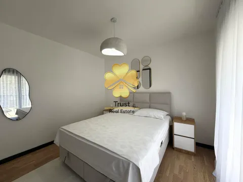 Furnished bedroom with a double bed and nightstands. - image 11