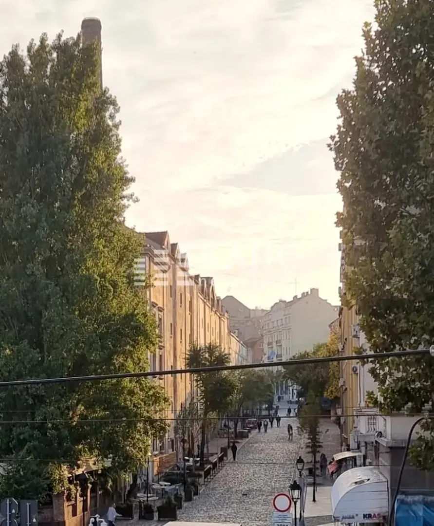 View from the terrace overlooking the street and buildings.