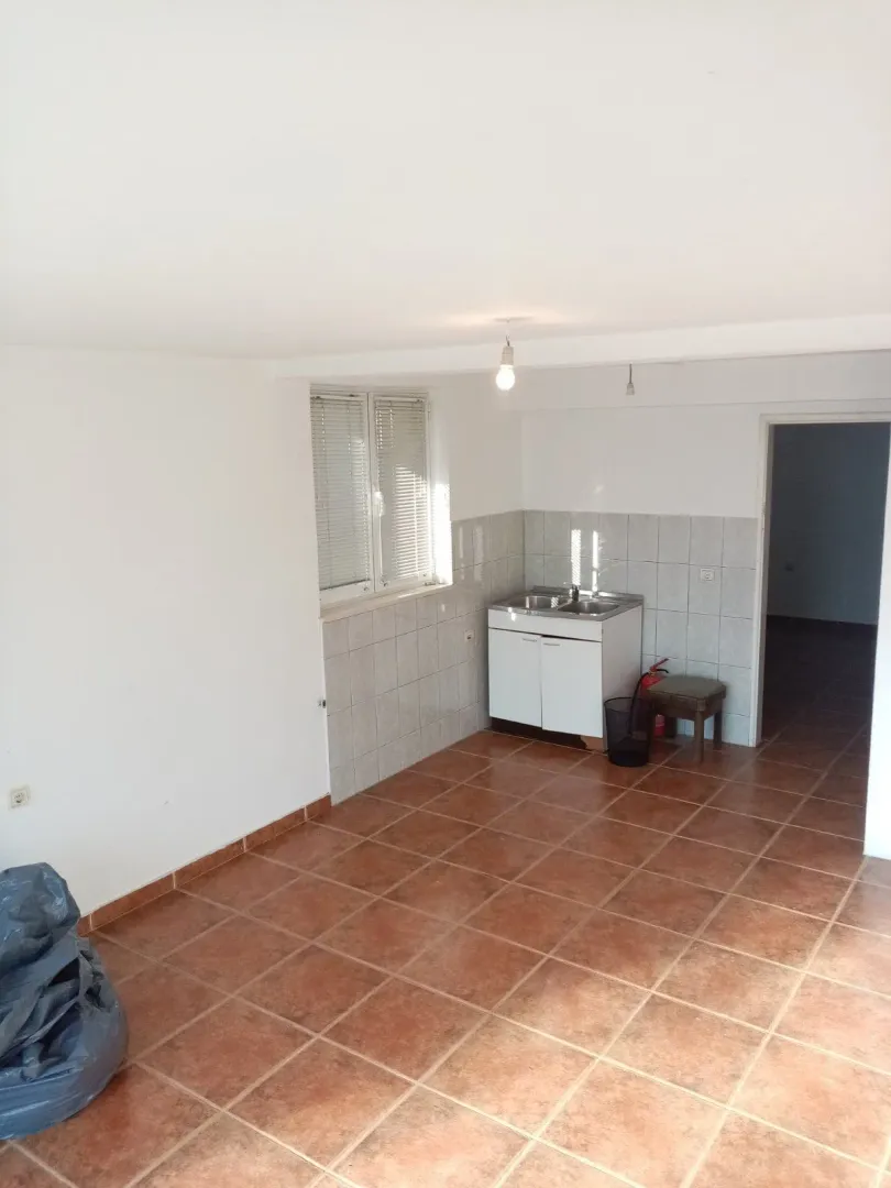 Simple kitchen space with tiled floors.