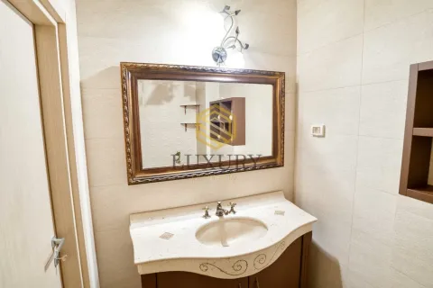 Bathroom with a sink and a large mirror. - image 13