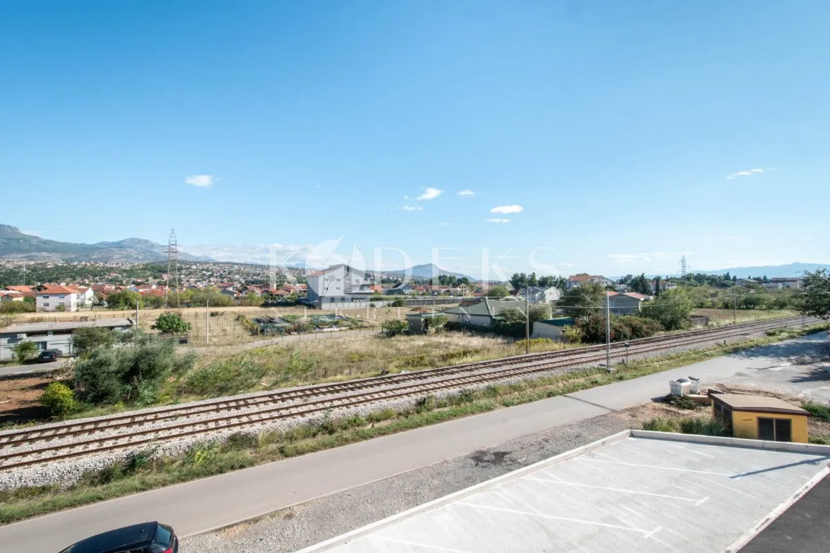 View from the property of the surrounding neighborhood, railway, and landscape.
