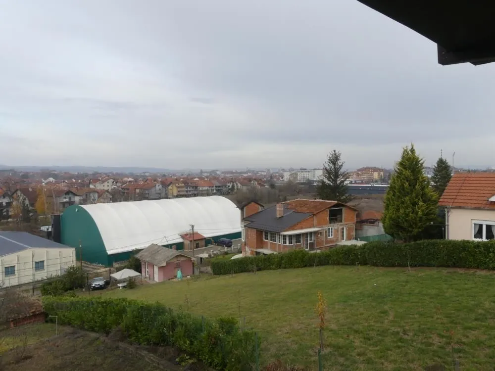 View from the property overlooking the surrounding neighborhood and greenery.