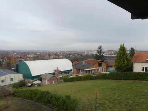 View from the property overlooking the surrounding neighborhood and greenery. - image 6