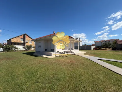 Single-story house with a spacious yard and lawn. - image 15