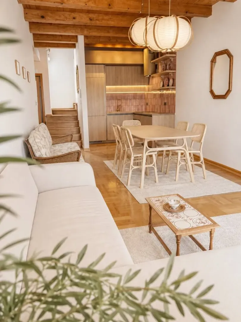 Spacious living room with a dining area and wooden ceiling.