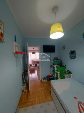 Children's bedroom with a bed and blue walls. - image 13