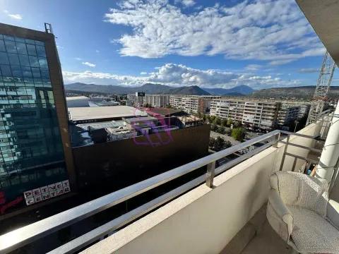 Balcony with a view of the city and surrounding mountains. - image 2