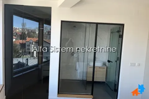 Modern bathroom with a glass walk-in shower. - image 10
