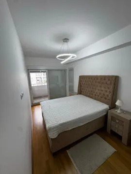 Furnished bedroom with a double bed and access to the terrace. - image 6