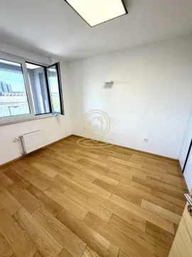 Empty room with hardwood flooring and a window. - image 7