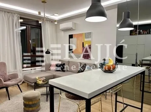 Living room with a sofa and dining table.