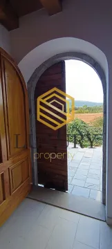 View through a traditional wooden door towards the courtyard and nature. - image 10
