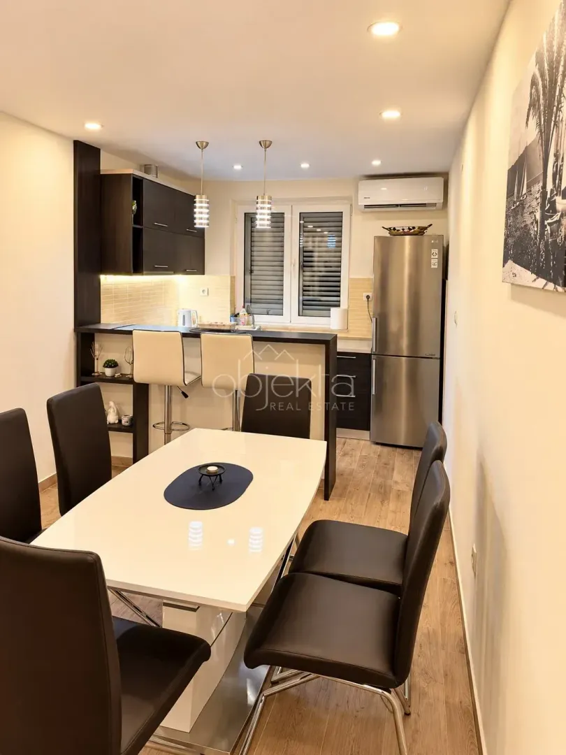 Kitchen with a dining area and modern fixtures.
