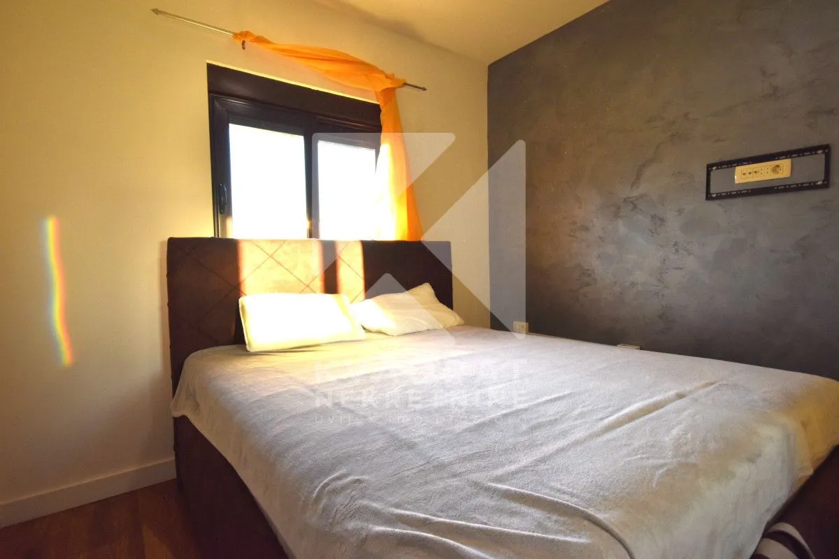 Bedroom with a double bed and a window.