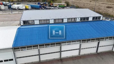 Aerial view of an industrial facility with warehouse space and parking. - image 4