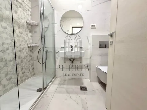 Modern bathroom with a walk-in shower, washbasin, and wall-hung toilet. - image 12