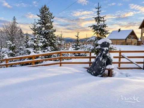 Snowy landscape with a wooden fence and coniferous trees during the winter. - image 27