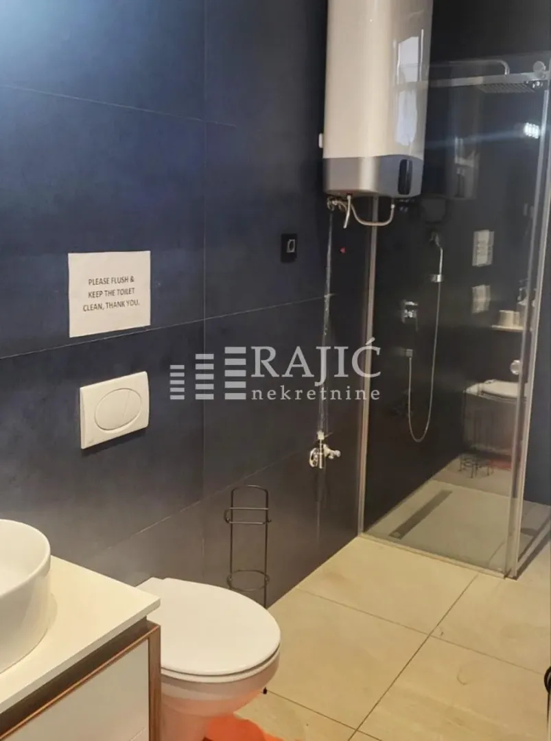 A modern bathroom with a walk-in shower.