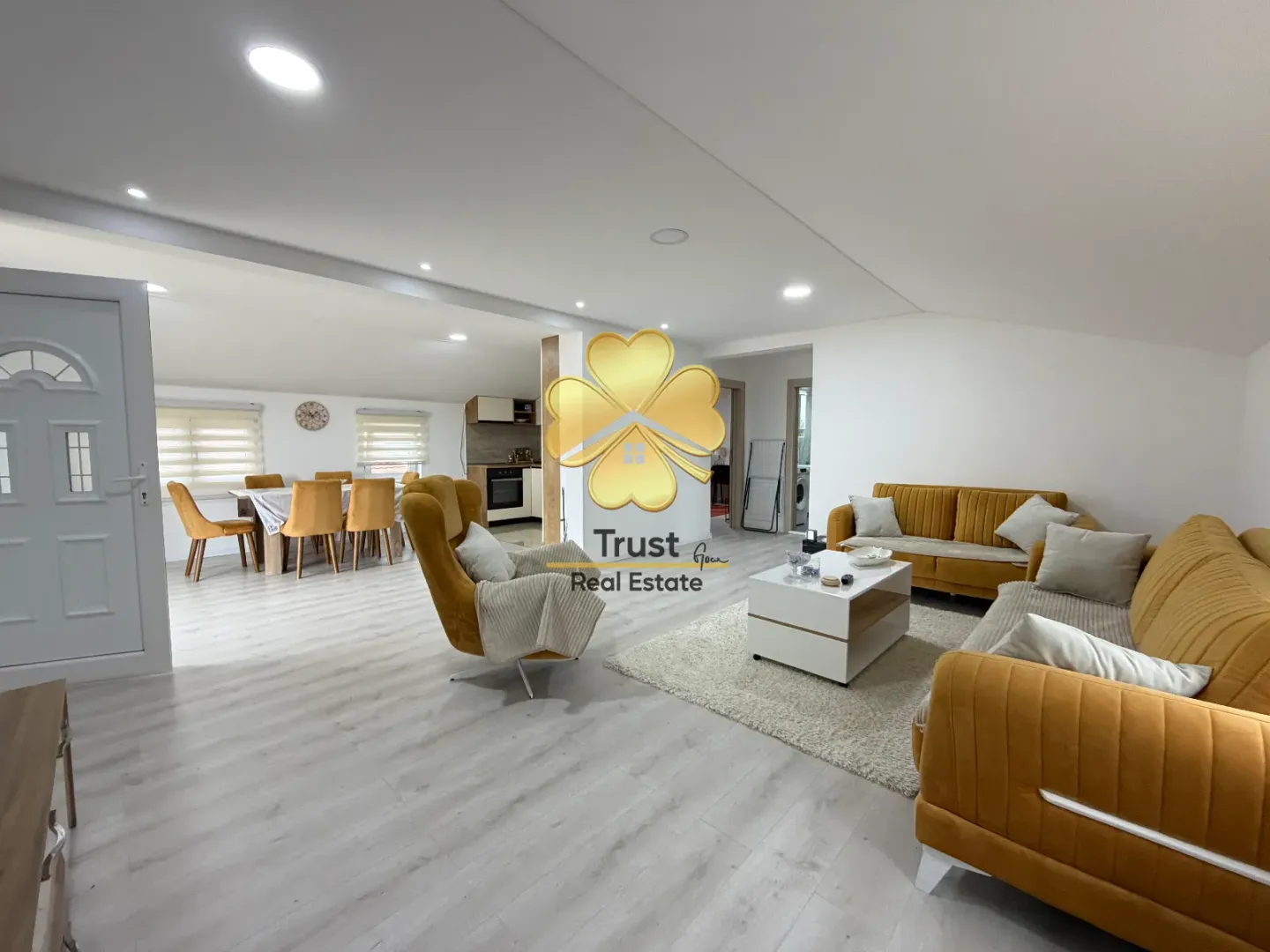 Spacious living room connected to the dining area and kitchen.