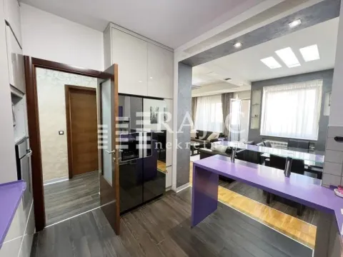 Modern kitchen connected to the dining room and living room. - image 6