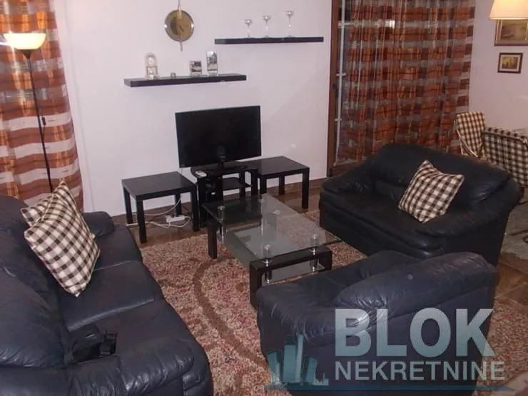 Living room with a seating set and TV.