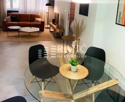 View of the dining area and living room with modern furniture. - image 7