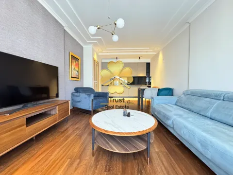 Spacious living room connected to the dining area and kitchen. - image 2