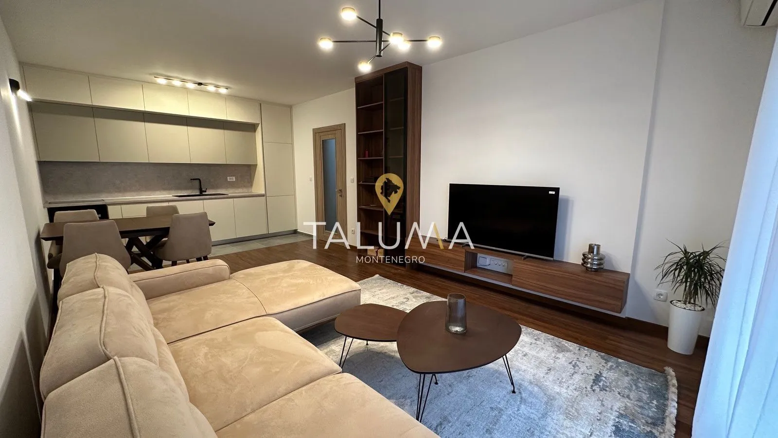 Spacious living room connected with the kitchen and dining area.