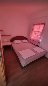 Furnished bedroom with a double bed. - image 2