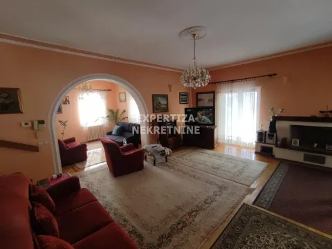 Spacious living room with seating set and fireplace. - image 6