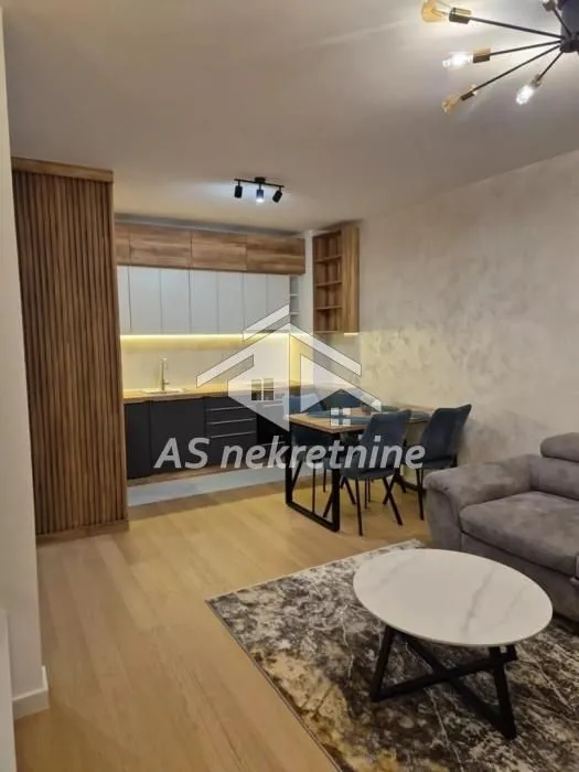 Living room with open-plan kitchen and dining area.