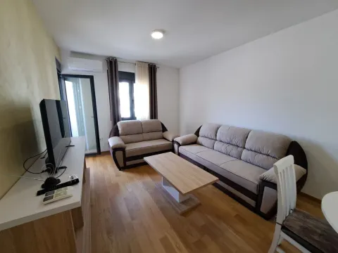 Living room with sofa set, coffee table and television. - image 2