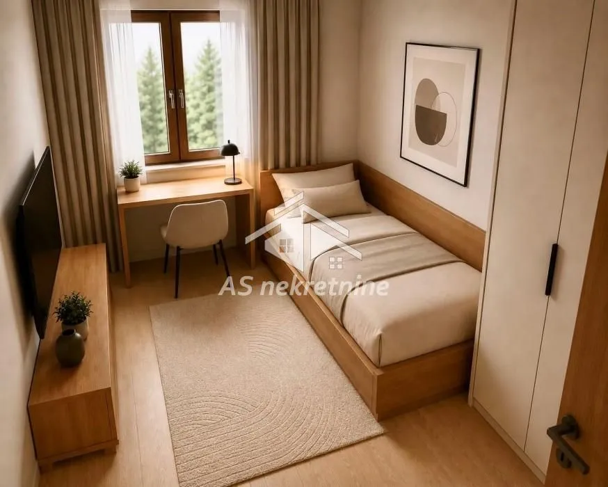 Small bedroom with a bed, a desk, and a wardrobe.