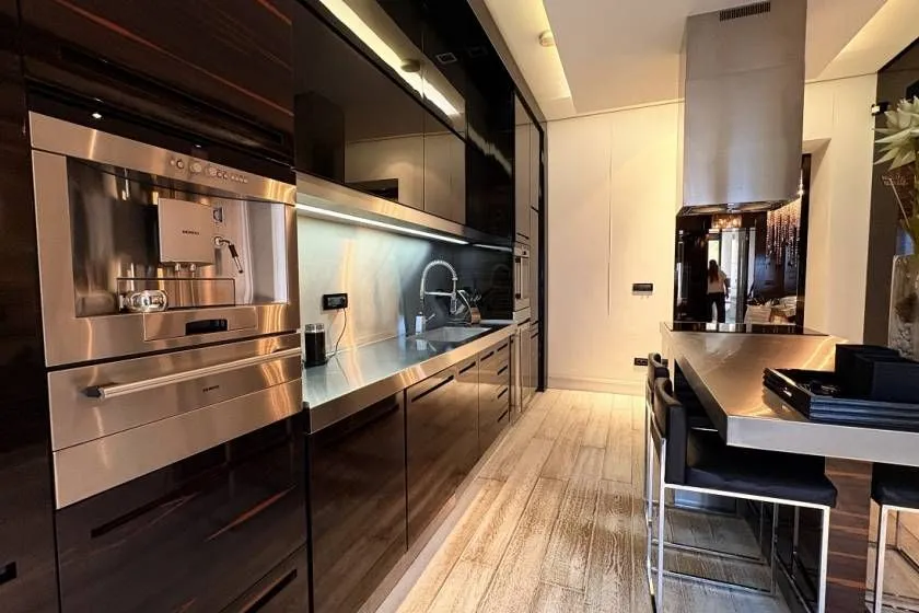 Modern kitchen with built-in appliances and a breakfast bar.
