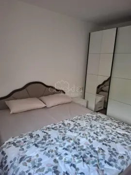 Bedroom with a double bed and a mirrored wardrobe. - image 9