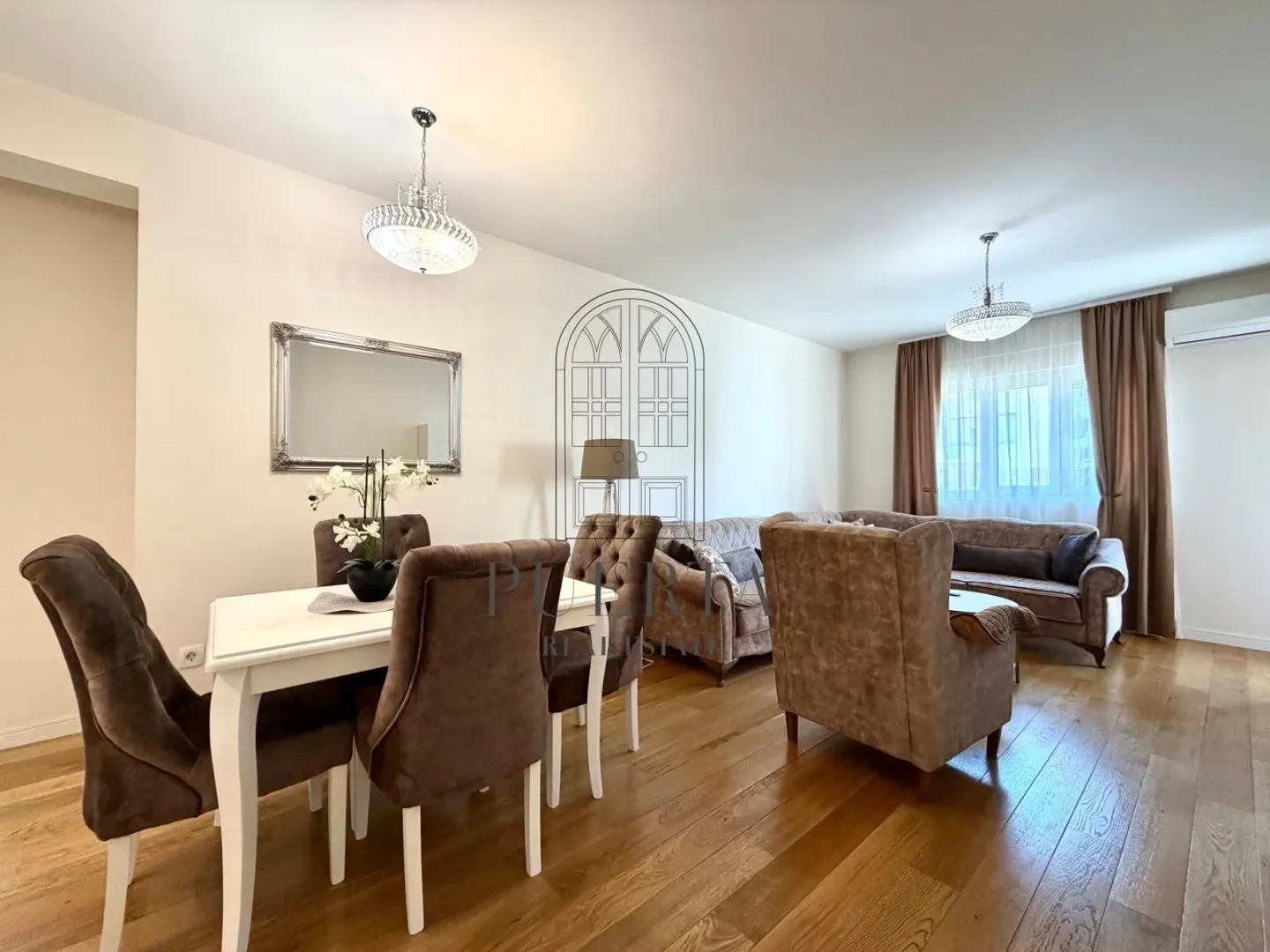 Spacious living room with a dining area and seating set.