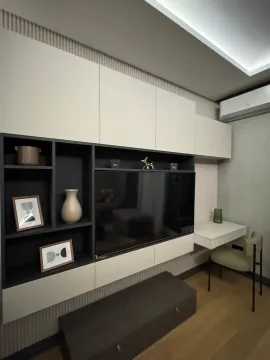 Living room with modern furniture and a TV unit. - image 8