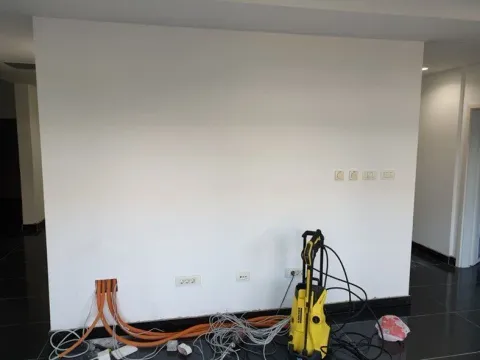Interior of a room with white walls and equipment on the floor. - image 10