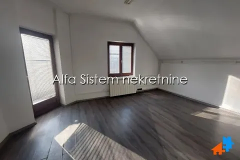 Empty attic room with laminate flooring and windows. - image 4