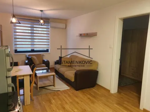Living room with sofa set, dining table and a window. - image 2